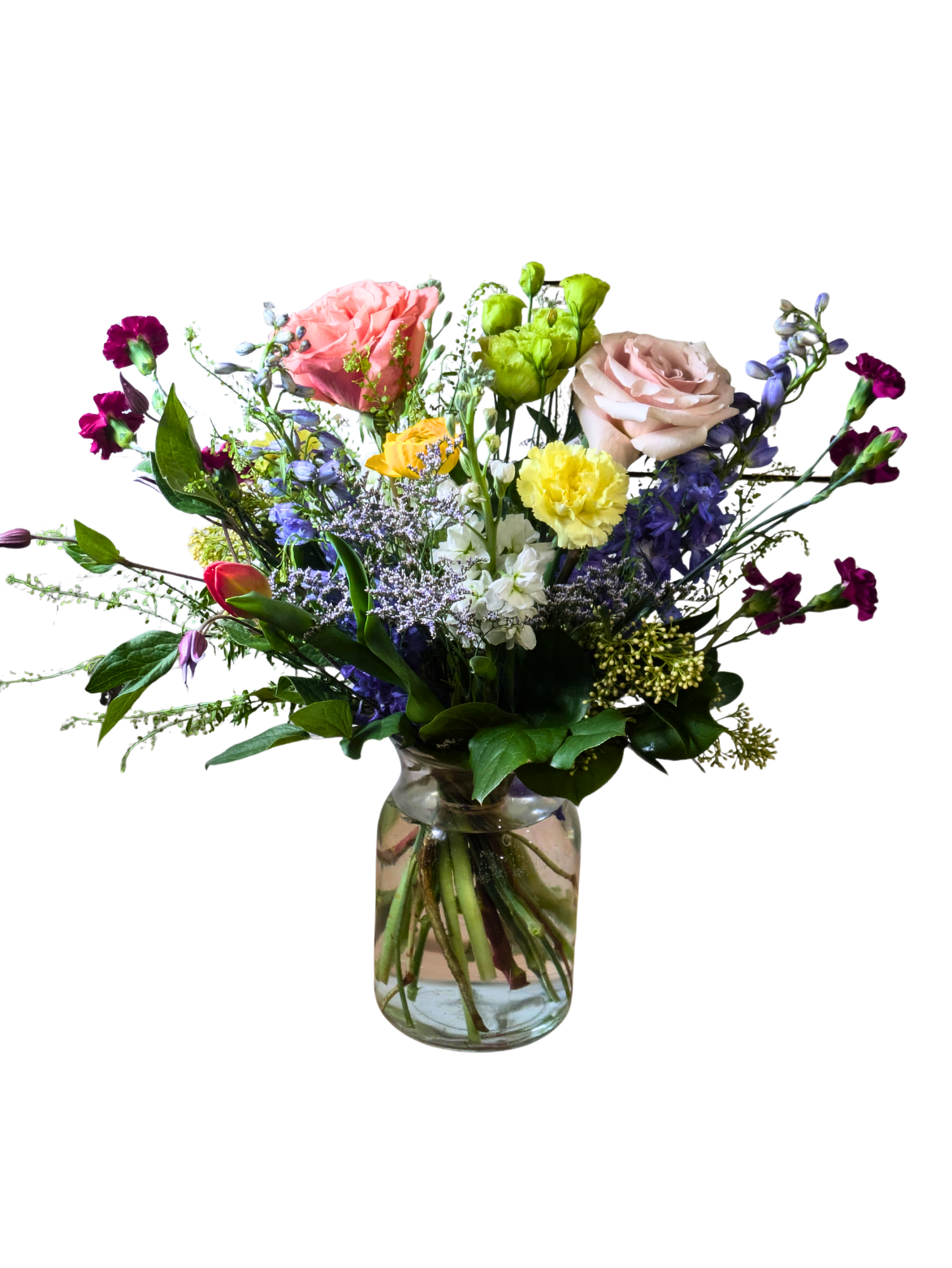 Designer's Choice vase arrangement with vibrant uplifting seasonal flowers arranged in a clear glass vase